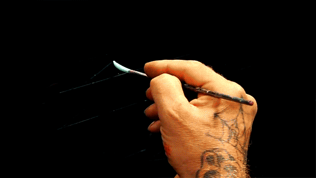 Nothing's more satisfying to watch than a heavily tattooed arm with amazing calligraphy skills.
