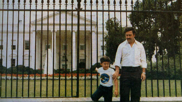 Drug kingpin Pablo Escobar and his son stand in front of The White House in the early 1980s.