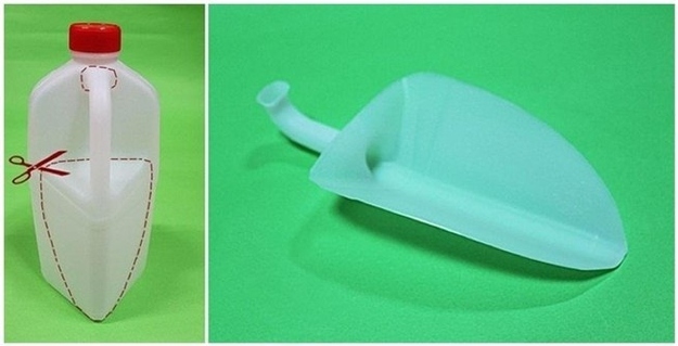 13. Cut the handle off of a jug for an easy, instant dustpan.