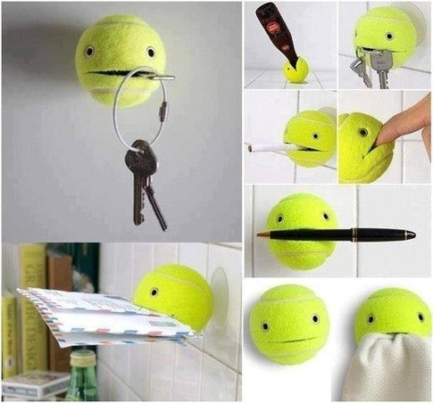 14. Glue a suction cup to a tennis ball and cut a strip in it. Now, that ball will hold anything for you.