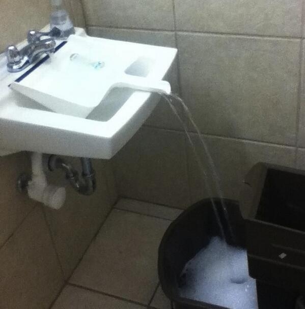 15. A dustpan in the sink can help you fill up buckets that don't fit.