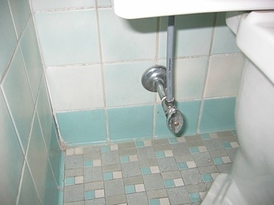8. If your toilet is clogged and overflowing, turn this knob. It will stop water from going into the tank.
