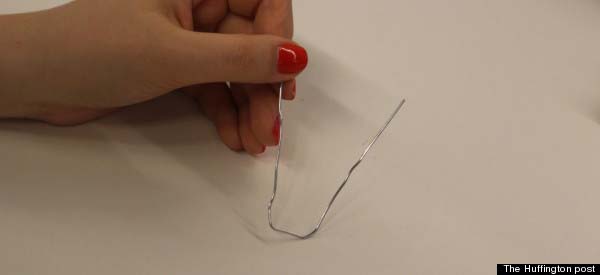 Then, in the middle bend the clip around the edge of your desk.