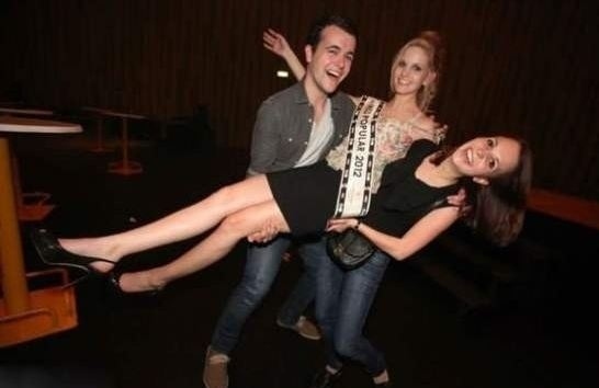 That's not the pose that you think it is - the girl on the right isn't in the air.