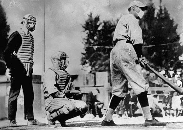 1.) The Spanish Flu Outbreak: The Spanish Flu of 1918 killed approximately 100 million people worldwide. This photo, although seemingly “normal,” shows just how frightened people were of the illness. They attempted to live their daily lives… but with serious precautions.